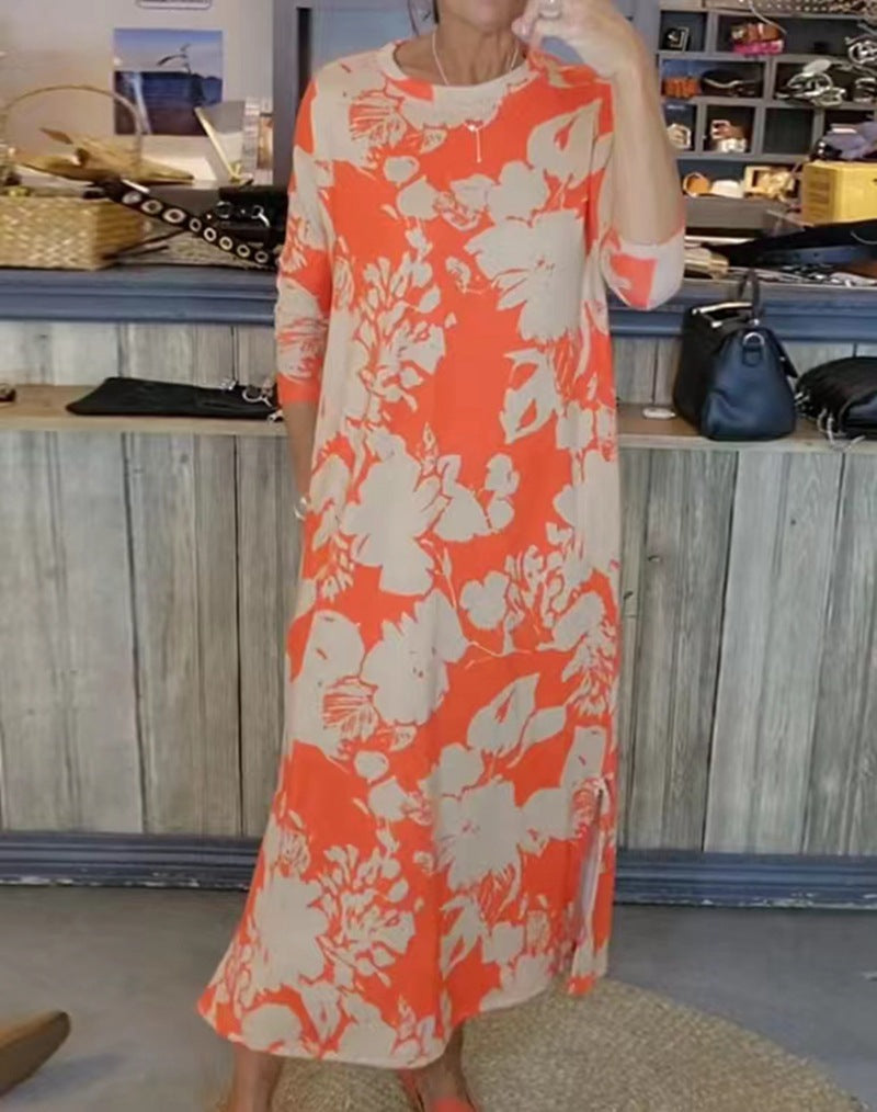 Women’s flowing A-line maxi dress with three-quarter sleeves round neckline side slit and inserted pockets Mune Fashion