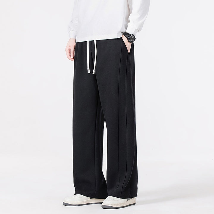 Men's leisure joggers in oversized cut with elastic drawstring waistband & distinctive side seam Mune Fashion