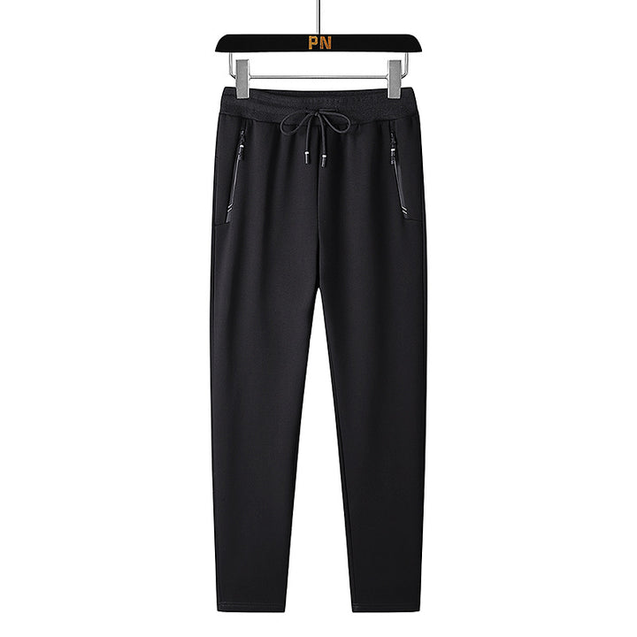 Men's thermo fleece jogging pants with brushed inner side, reflective zipper pockets and drawstring waistband Mune Fashion