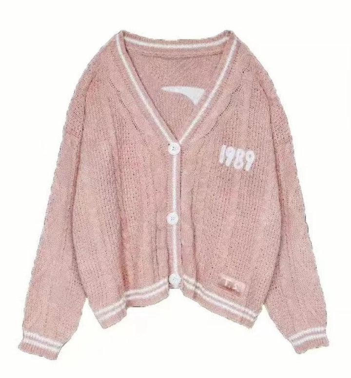 Women’s cropped cardigan with V-neck, contrast piping and oversized sleeves Mune Fashion