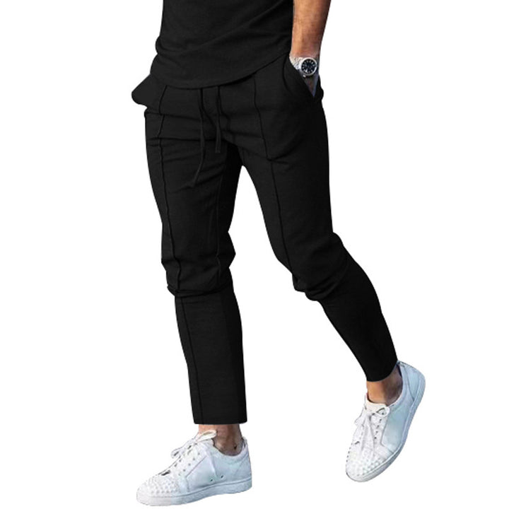 Men's Slim Tapered Jogging Pants with decorative stitching, elastic drawstring, and narrow ankle cuffs Mune Fashion