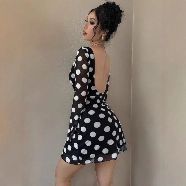 Women's figure-hugging transparent mesh mini dress with deep back neckline and polka dot pattern Mune Fashion