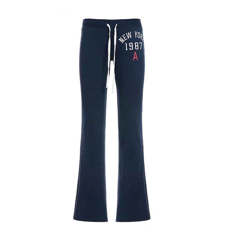 Women's soft flared jogging pants with drawstring, side pockets, and eye-catching Love print Mune Fashion