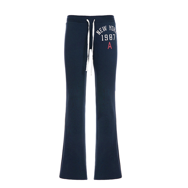 Women's soft flared jogging pants with drawstring, side pockets, and eye-catching Love print Mune Fashion