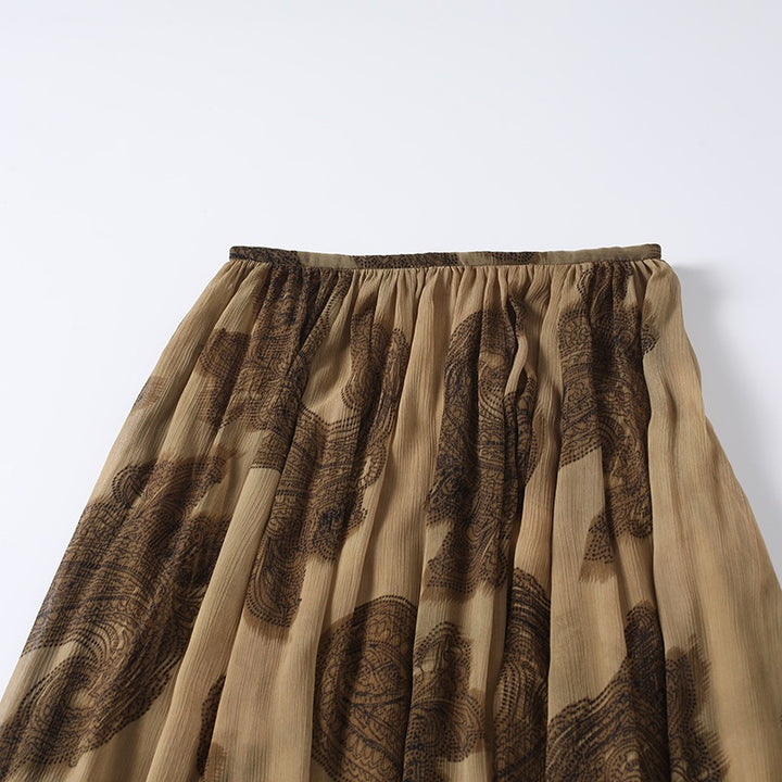 Women's maxi skirt made of chiffon with pleats, elastic waistband, and ruffled hem Mune Fashion