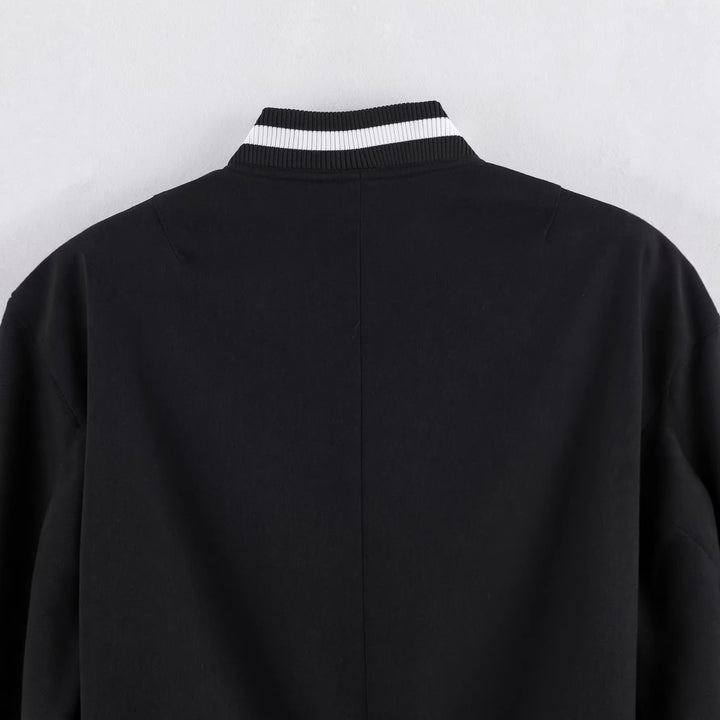 Women's varsity bomber jacket in cropped boxy cut with striped ribbed cuffs Mune Fashion