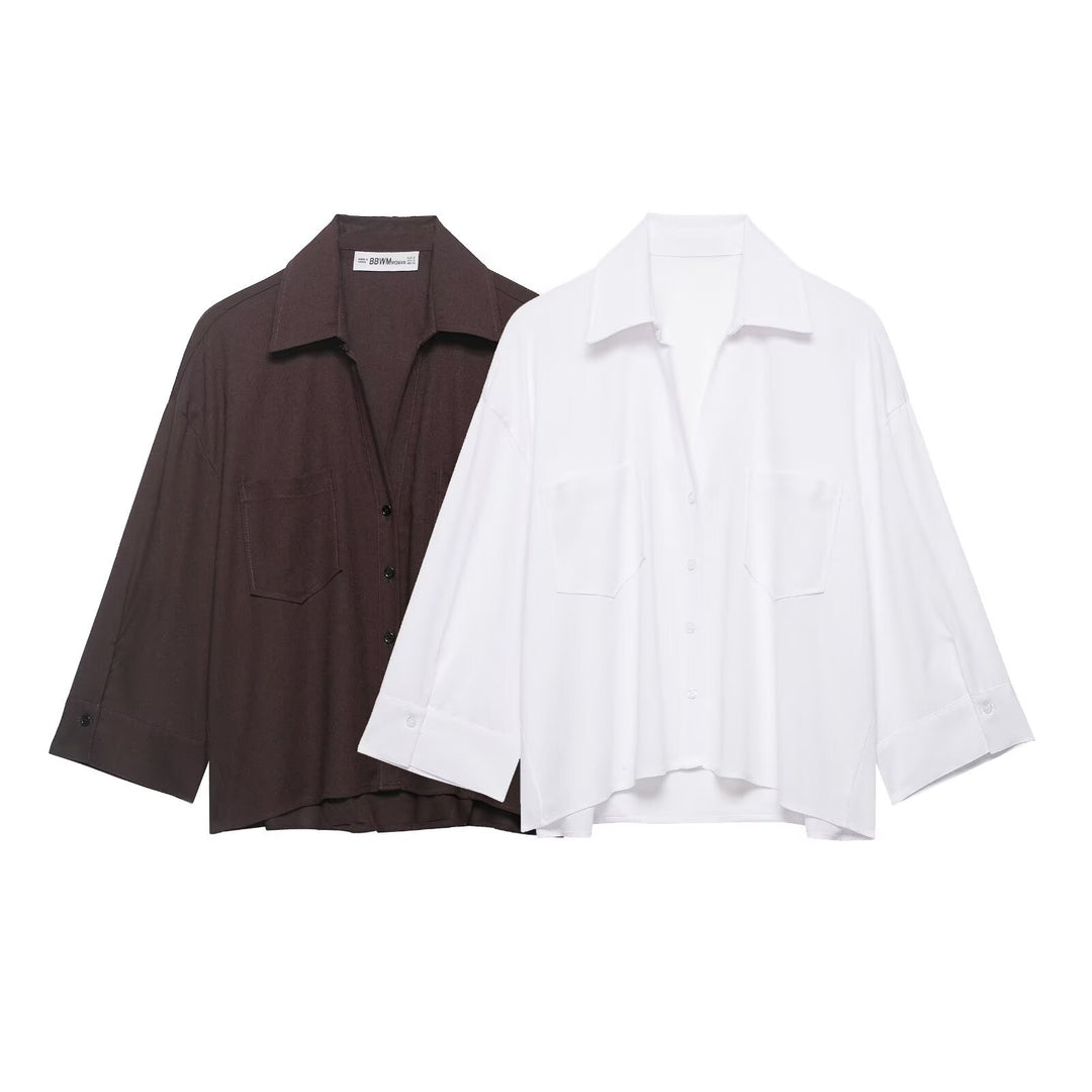 Women's oversized shirt blouse with fine striped pattern, chest pockets, and high-low hem Mune Fashion