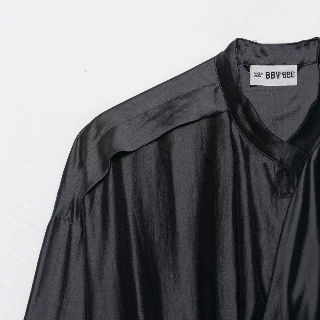 Women’s blouse with stand-up collar, drawstring waistline, and wide cuffs