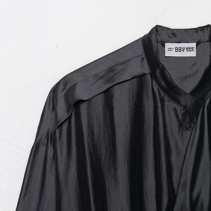 Women’s blouse with stand-up collar, drawstring waistline, and wide cuffs