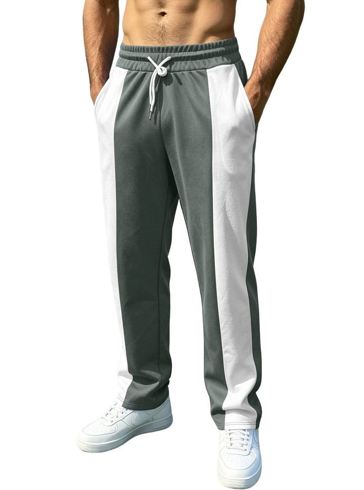 Men's sporty jogging pants with contrasting side inserts, elastic waistband, drawstring, and side pockets Mune Fashion