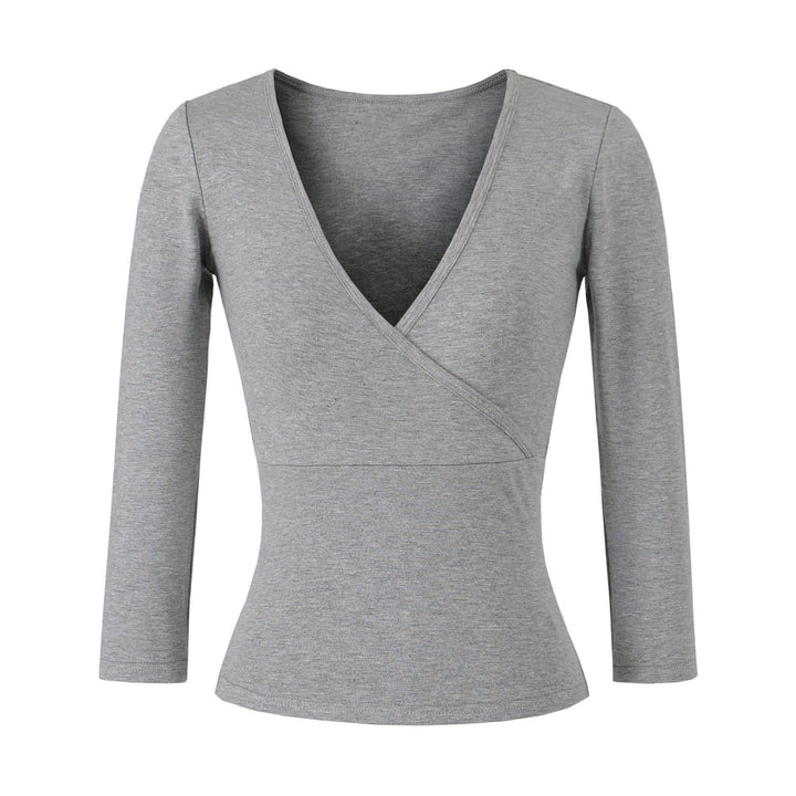 Women's figure-hugging wrap top made of stretch jersey with deep V-neck and tailored silhouette.