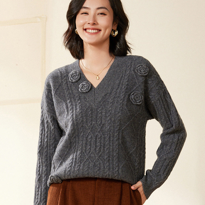 Women's cable knit V-neck sweater with three-dimensional floral appliqués made from soft wool blend Mune Fashion