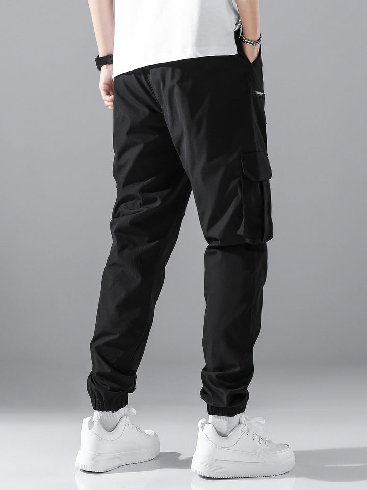 Men's slim cargo joggers with multiple zippered pockets, elastic ankle cuff, and drawstring Mune Fashion