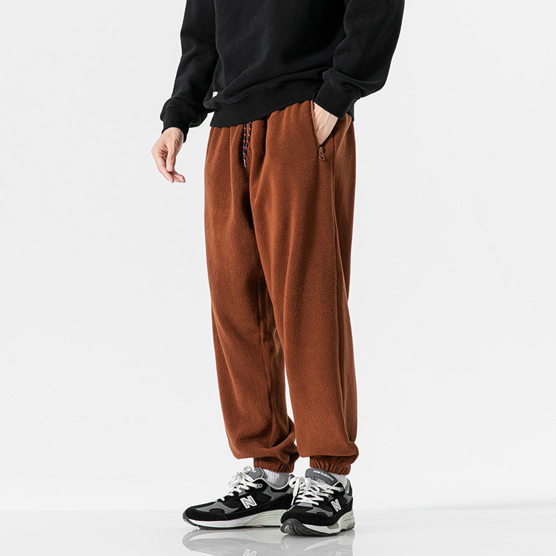 Men's wide-cut fleece jogging pants with elastic cuffs and side pockets Mune Fashion