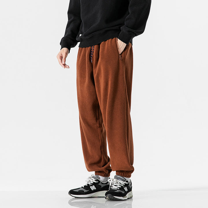 Men's wide-cut fleece jogging pants with elastic cuffs and side pockets Mune Fashion