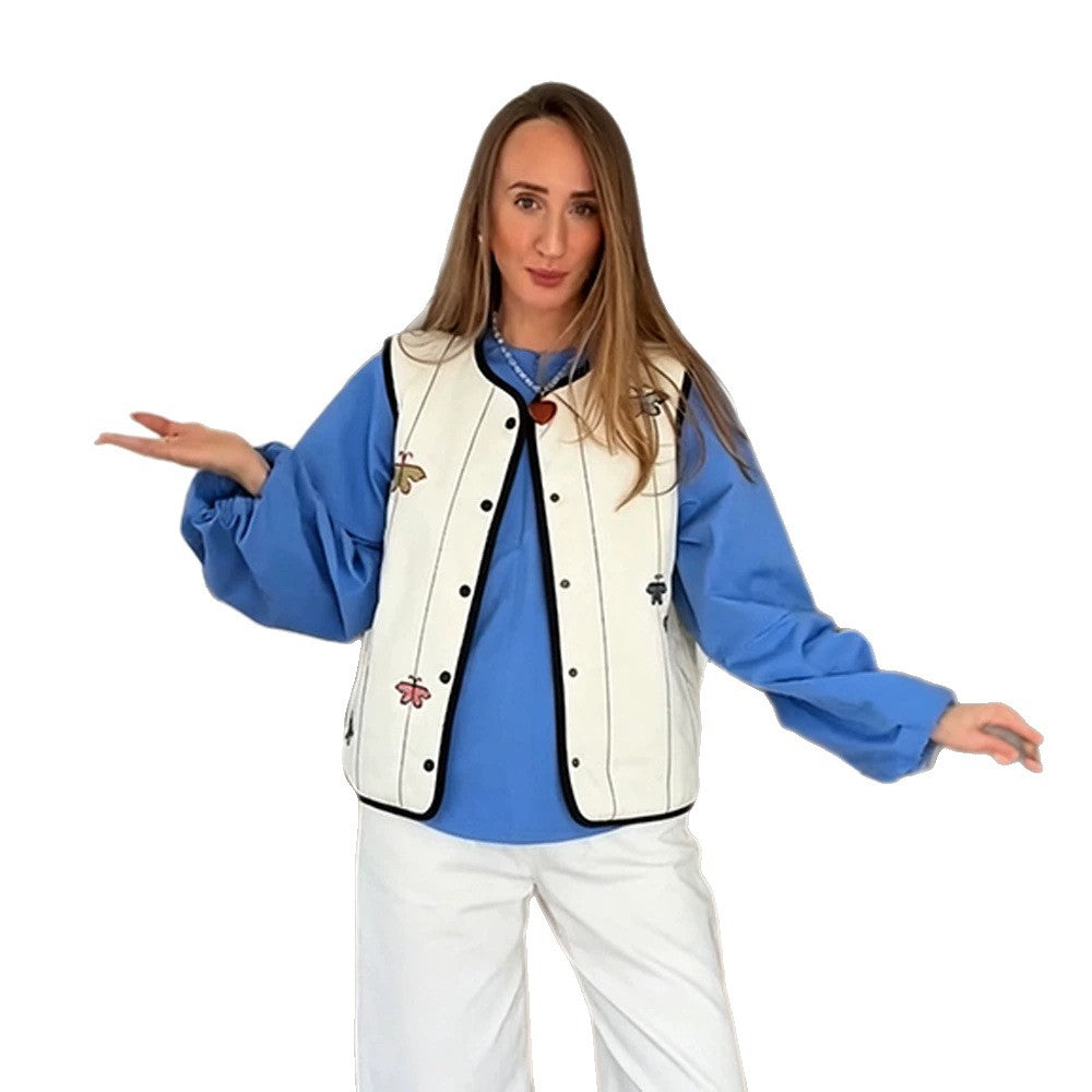 Women's quilted vest with embroidery patterns, contrasting piping and snap button closure Mune Fashion