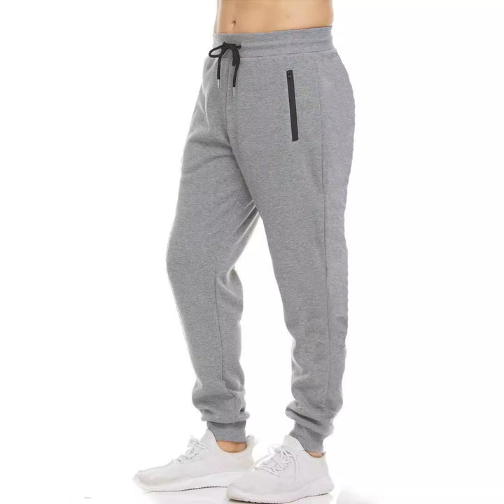 Women's nan tapered jogging pants with elastic comfort waistband, water-repellent zip pocket and ribbed ankle cuffs Mune Fashion