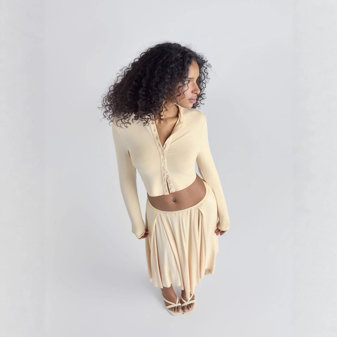 Women Cropped Cardigan with Pearl Buttons and Asymmetrical Pointed Midi Skirt Drune
