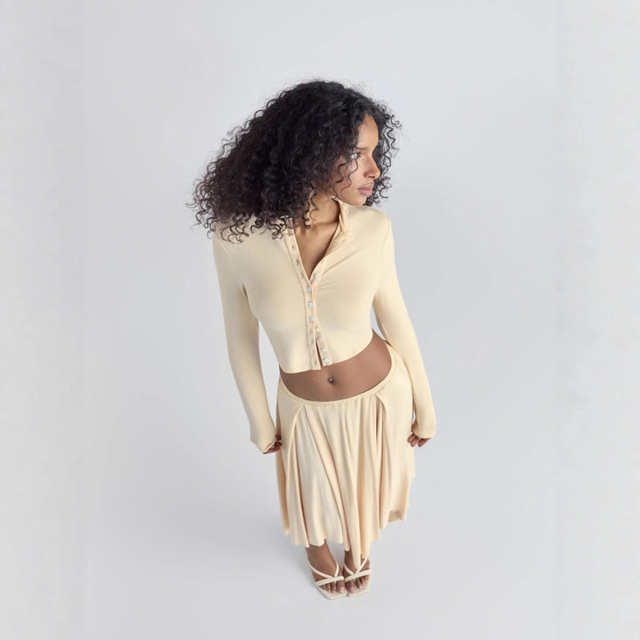 Women Cropped Cardigan with Pearl Buttons and Asymmetrical Pointed Midi Skirt Drune