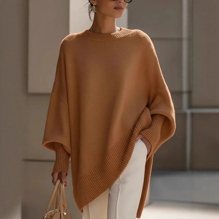 Women's oversized knit poncho with asymmetrical hem and ribbed sleeves Mune Fashion