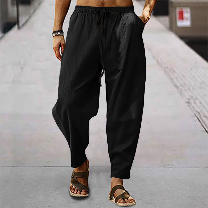 Men's loose linen casual pants with elastic tunnel drawstring waistband, low crotch, and tapered ankle length Mune Fashion