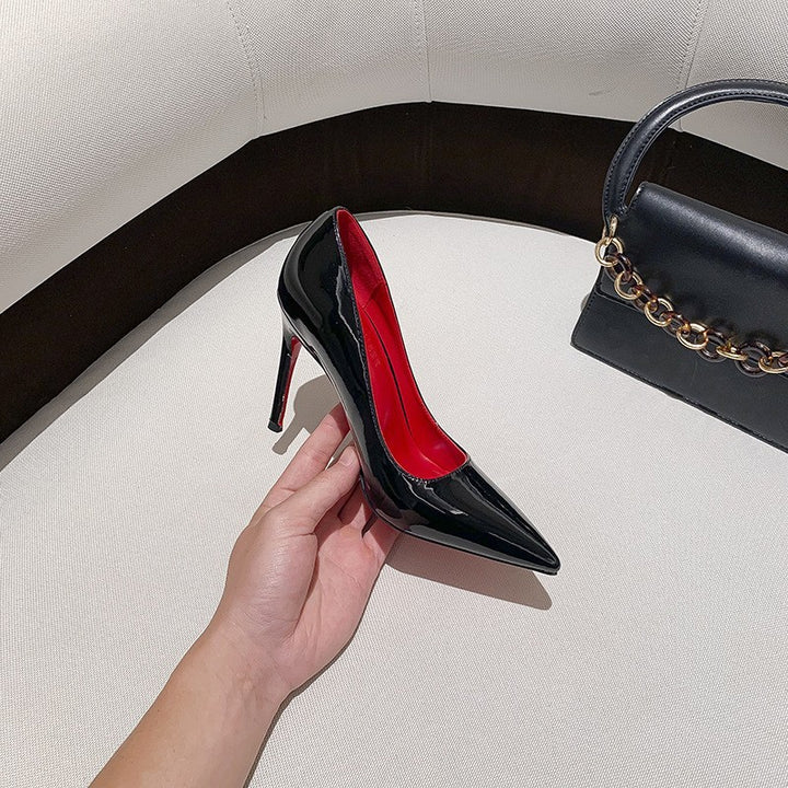Ladies' pointed pumps with high stiletto heel and strap