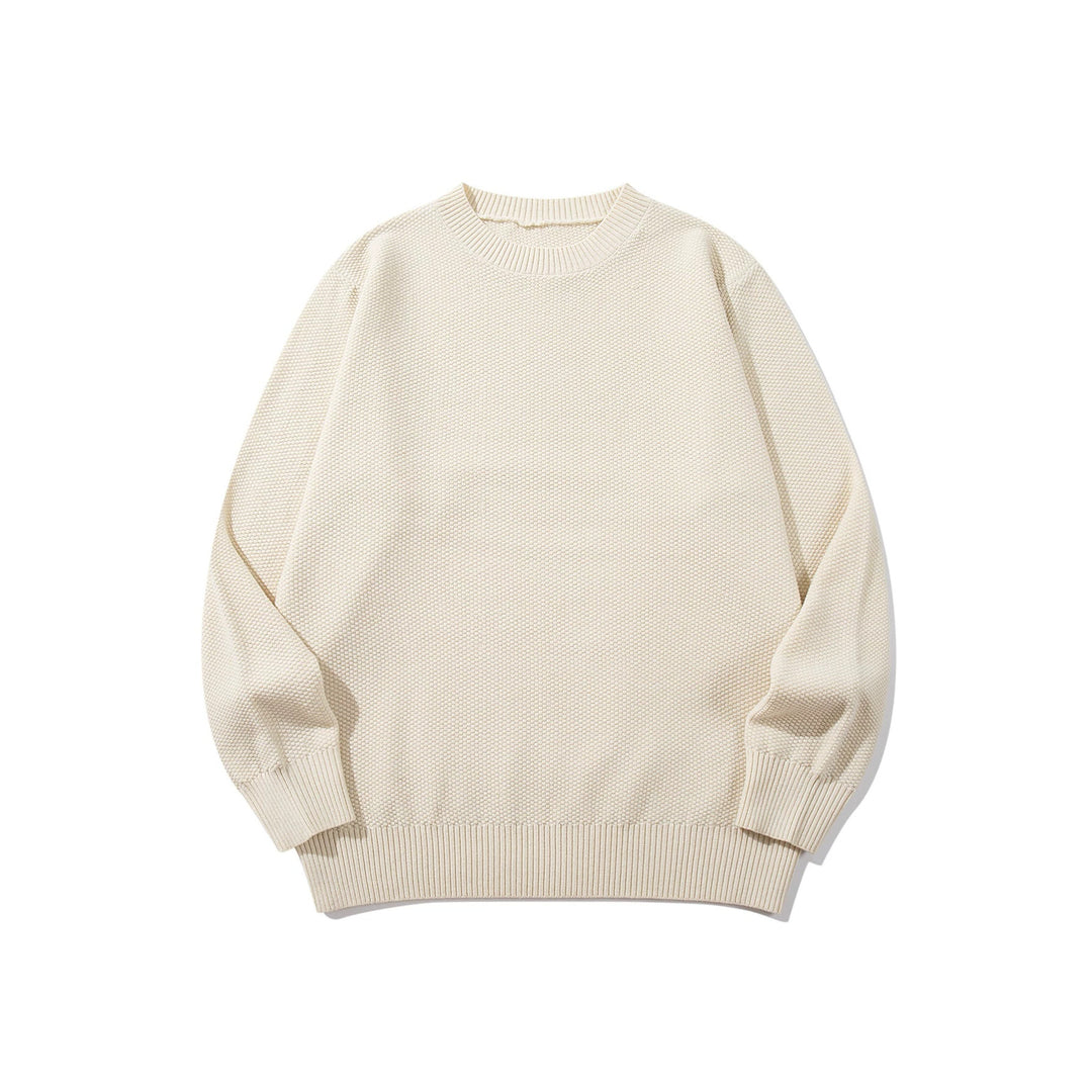 Unisex chunky knit round neck sweater with textured purl stitch and ribbed cuffs