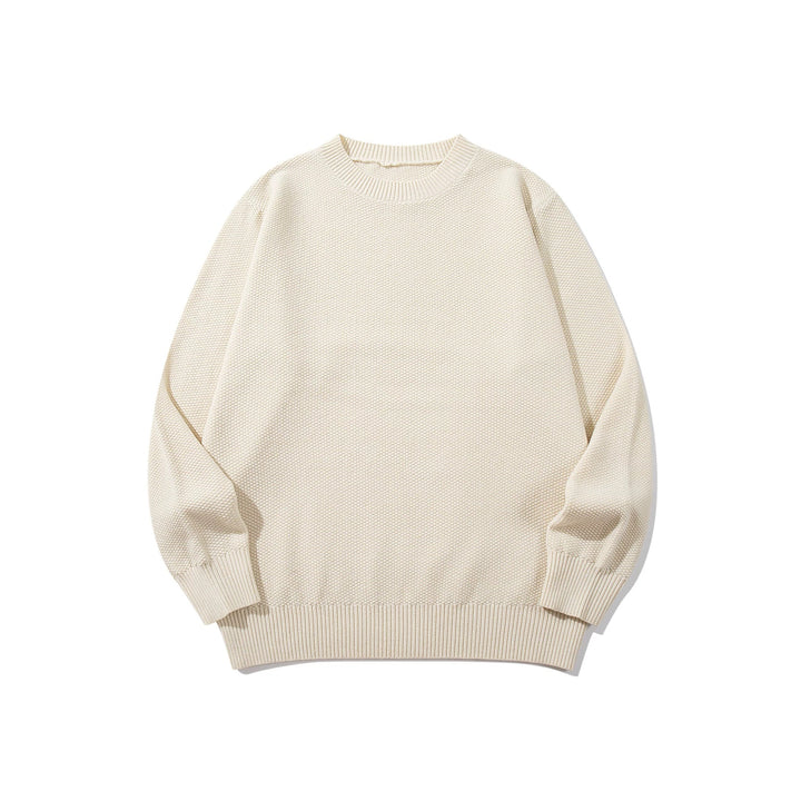 Unisex chunky knit round neck sweater with textured purl stitch and ribbed cuffs