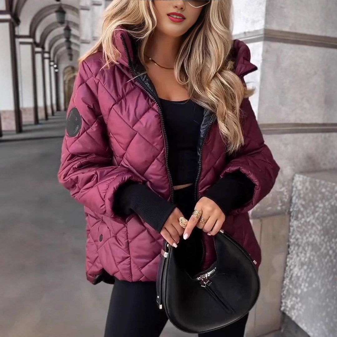 Women's quilted hooded winter jacket with padded thermal filling, full-length zipper, and elastic cuffs Mune Fashion