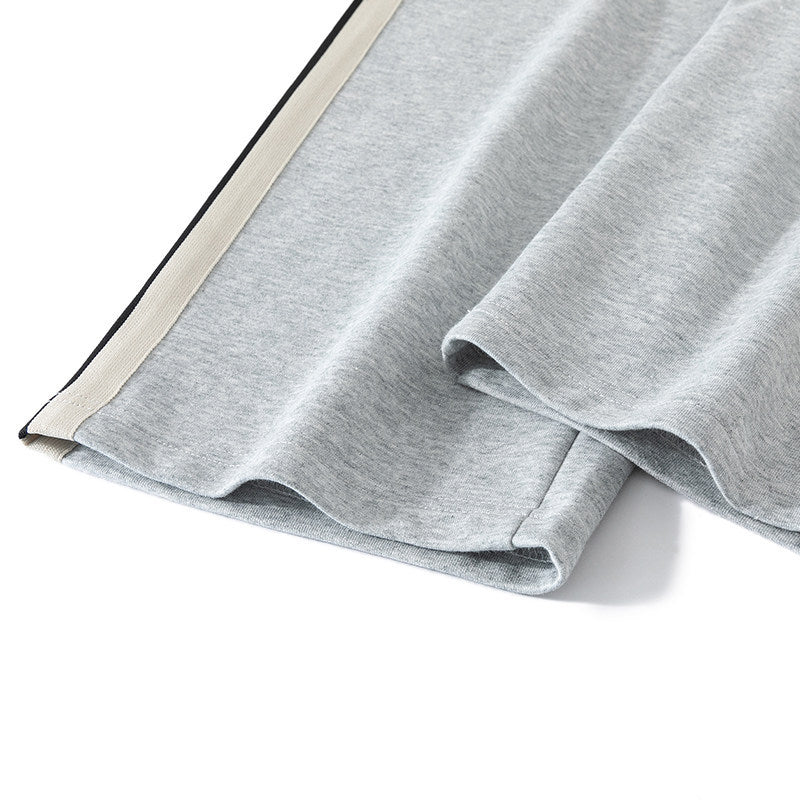 Men's loose-fitting joggers with elastic waistband, drawstring, and contrasting side stripes Mune Fashion