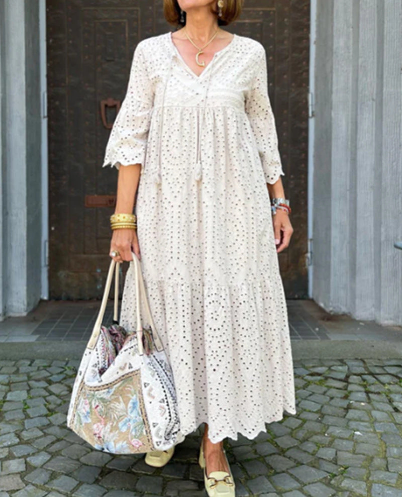 Women's flowing maxi dress with openwork embroidery, V-neck, underbust seam, and ruffled skirt Mune Fashion