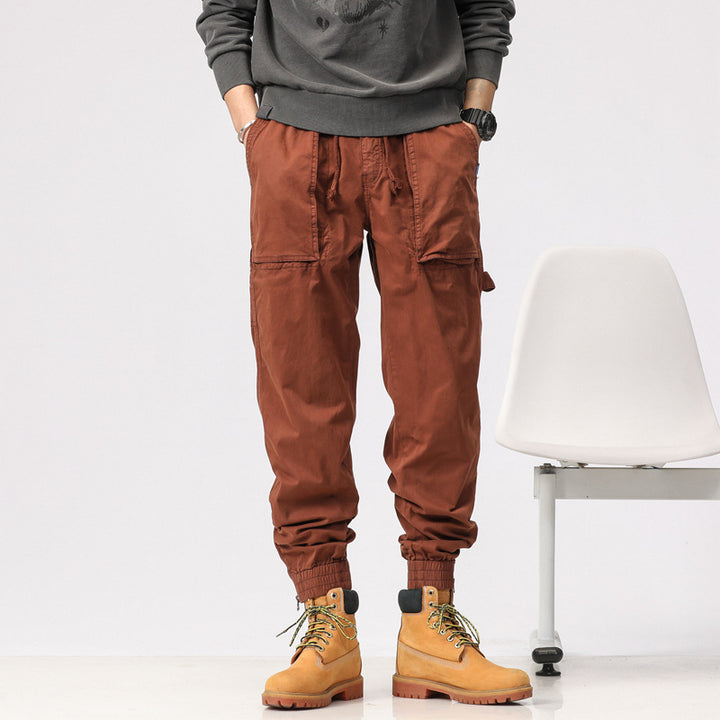 Men's workwear cargo pants in tech jogger style with applied front pockets, hammer loop, and ankle zippers Drune