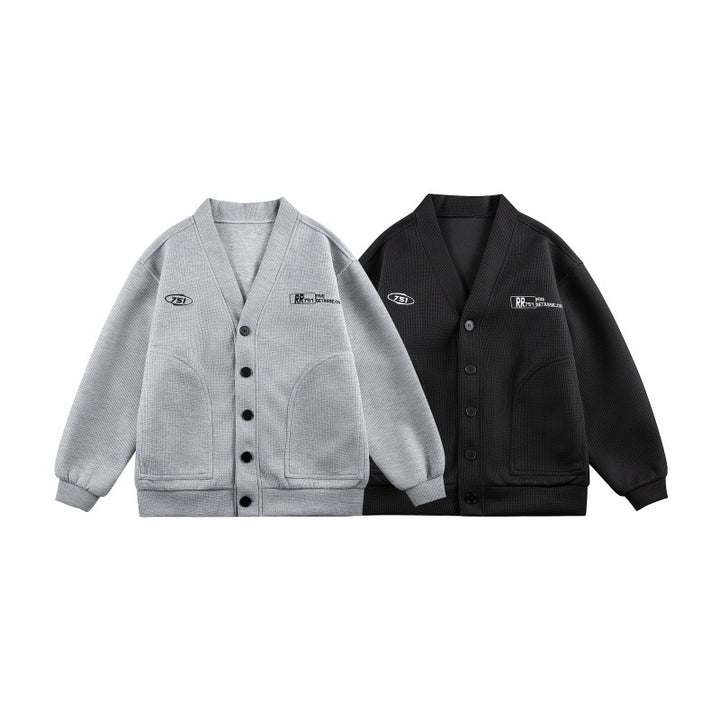 Unisex Boxy knit cardigan in waffle knit with V-neck, continuous button placket, and applied round pockets Mune Fashion