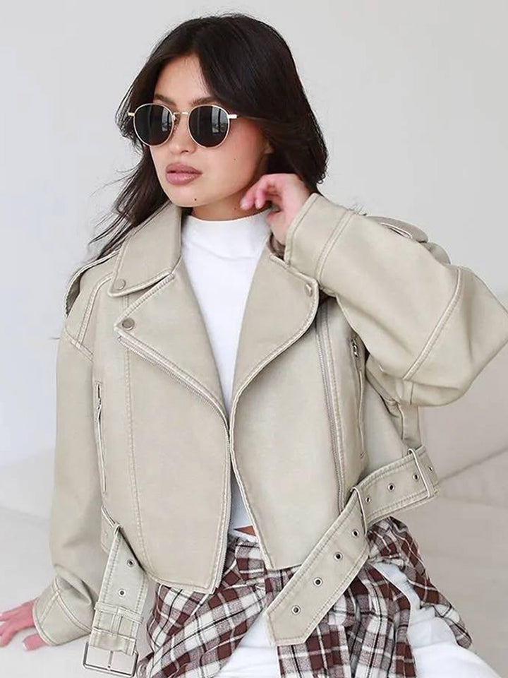 Women's short biker jacket made of vegan leather with a wide waist belt and visible decorative stitching Mune Fashion