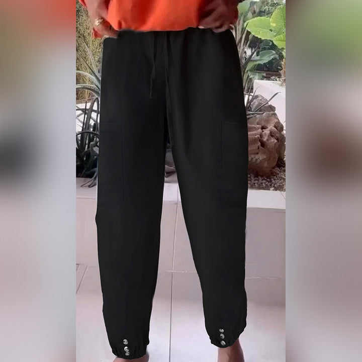 Ladies cargo jogging pants with drawstring, patch pockets and button cuffs Mune Fashion
