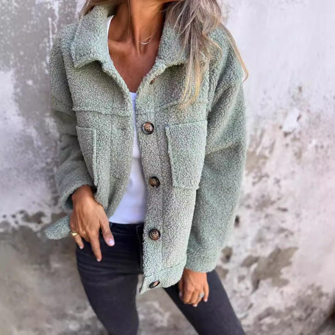 Ladies teddy jacket with large lapel collar, continuous button placket, and patch pockets Mune Fashion