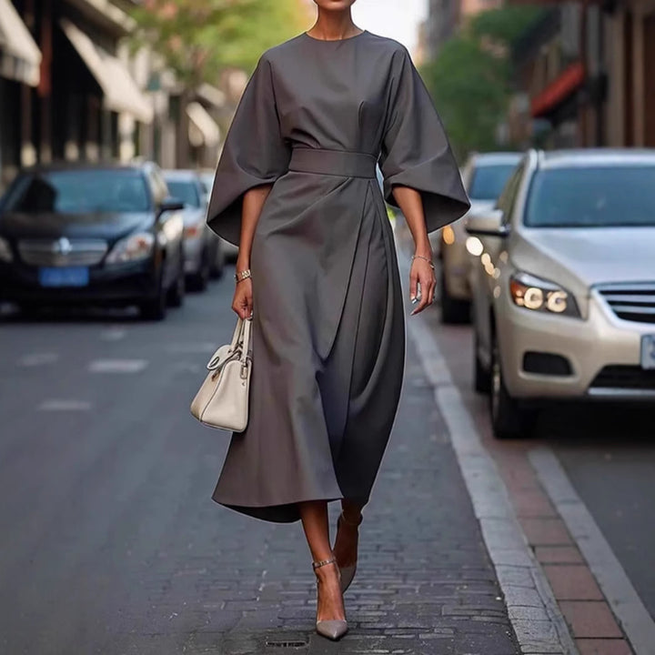 Women's minimalist evening dress with overlong wide sleeves and waist-sculpting pleat draping Mune Fashion