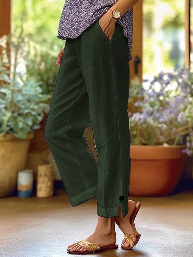 Women's linen trousers with a relaxed, ankle-length fit, side pockets and decorative button details Mune Fashion