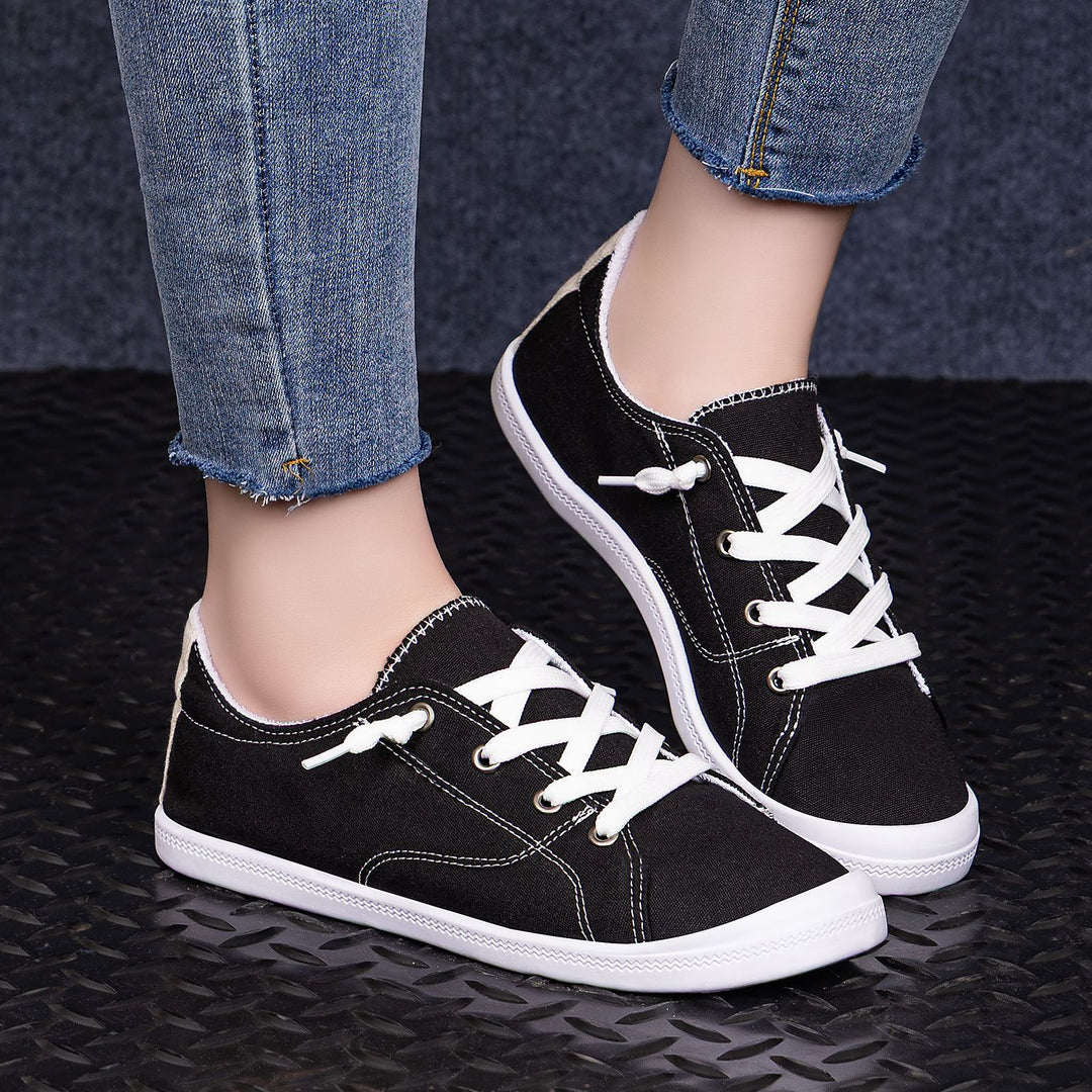Women’s classic canvas low-top sneakers with reinforced rubber sole, metal eyelets, and padded heel collar Mune Fashion
