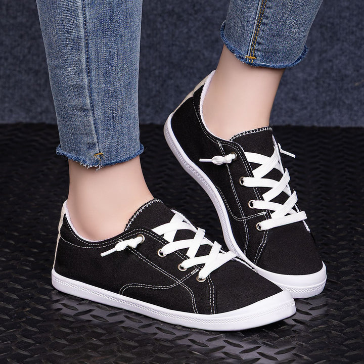 Women’s classic canvas low-top sneakers with reinforced rubber sole, metal eyelets, and padded heel collar Mune Fashion