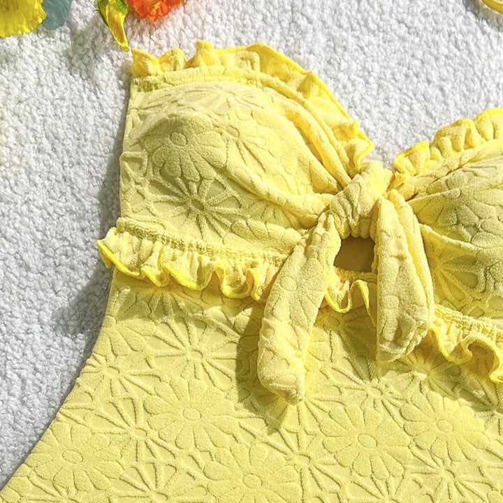 Women's swimsuit with playful ruffle design and trendy knot detail Mune Fashion