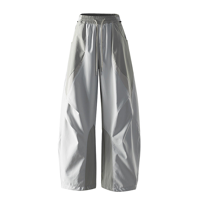 Women's wide technical balloon pants with drawstring waistband and insert panels