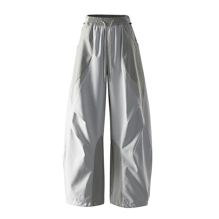 Women's wide technical balloon pants with drawstring waistband and insert panels
