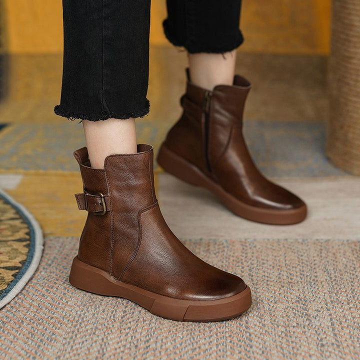 Ladies ankle-height leather-look sneaker boots with adjustable heel strap, pull tab, and non-slip rubber sole Mune Fashion