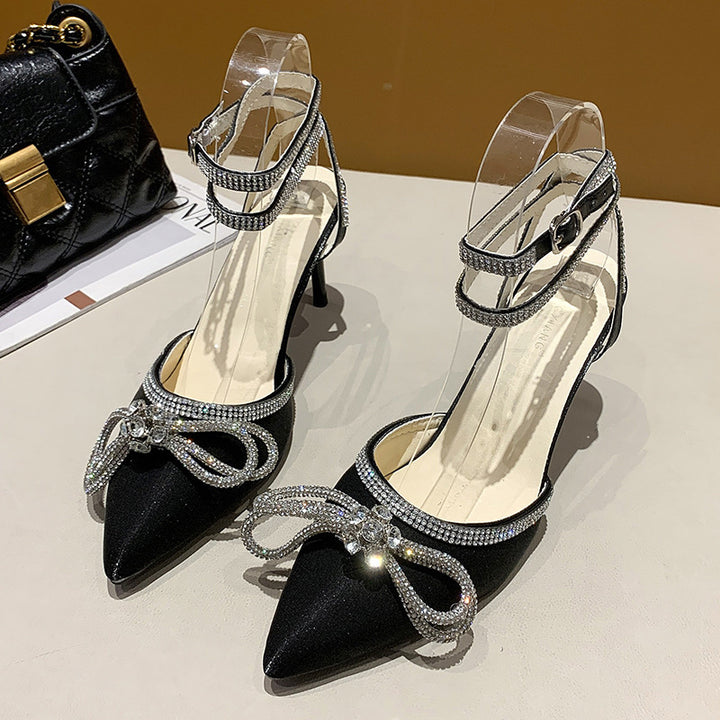 Women's pointed strap pumps with sparkling rhinestone bow appliqué and adjustable ankle strap Mune Fashion
