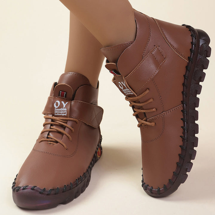 Women ankle-high comfort lace-up booties with Velcro closure and textured rubber outsole Mune Fashion