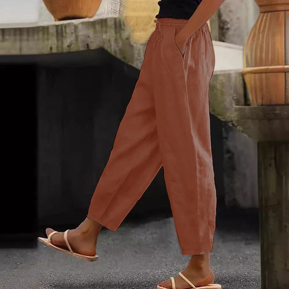 Women's loose-fitting linen blend pants with elastic waistband, drawstring, and angled side pockets Mune Fashion