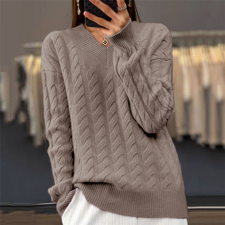Women's soft draping cable knit sweater with V-neck, oversized cut and ribbed hem Mune Fashion