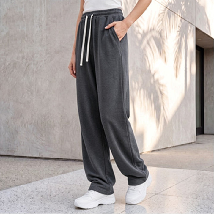 Women's wide lounge palazzo pants with high comfort waistband, drawstring, side pockets, and decorative side seam Mune Fashion