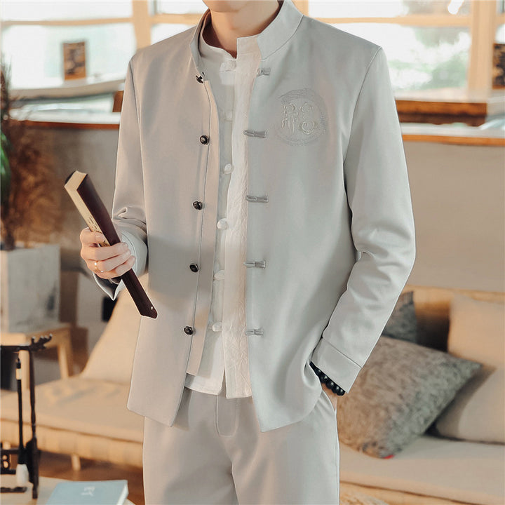 Men's Asian-inspired Mandarin jacket with stand-up collar, knot button placket, and tonal embroidered emblem Mune Fashion